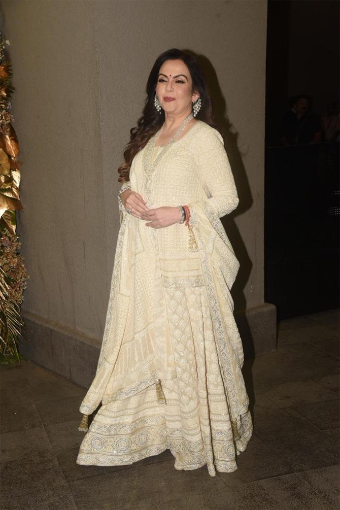 In photo: Nita Ambani snapped at her traditional best for Armaan Jain and Anissa Malhotra's grand wedding bash held at The St Regis hotel.