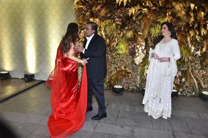 In photo: Mukesh Ambani greets actress Malaika Arora as wife Nita Ambani looks on with a smile.