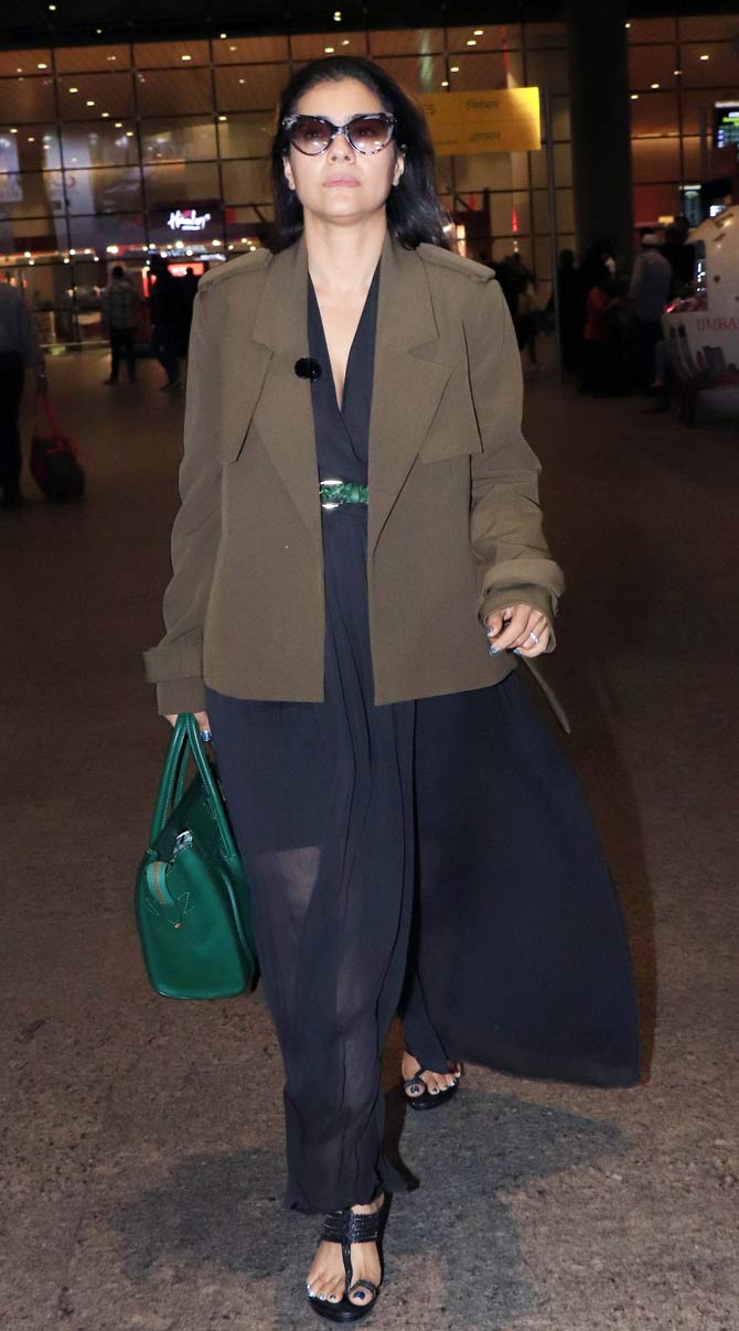 Kajol opted for a black maxi dress, which she paired with a brown oversized jacket as her Airport look!