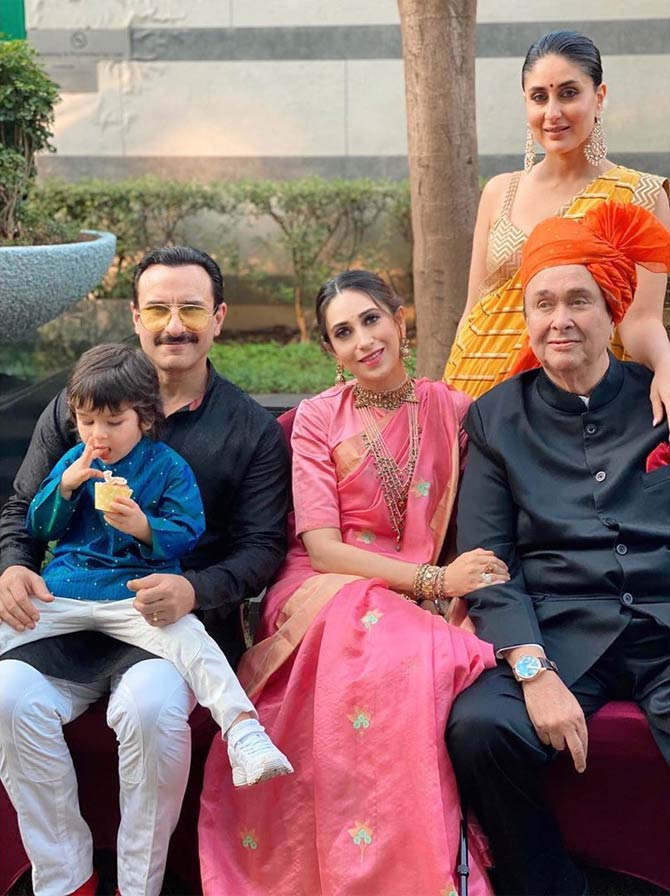 Saif Ali Khan, Karisma Kapoor, Taimur Ali Khan, Randhir Kapoor and Kareena Kapoor posed for the perfect family picture. That's what weddings are for, to make memories. But what grabbed our attention was Taimur Ali Khan gorging on a cupcake.
