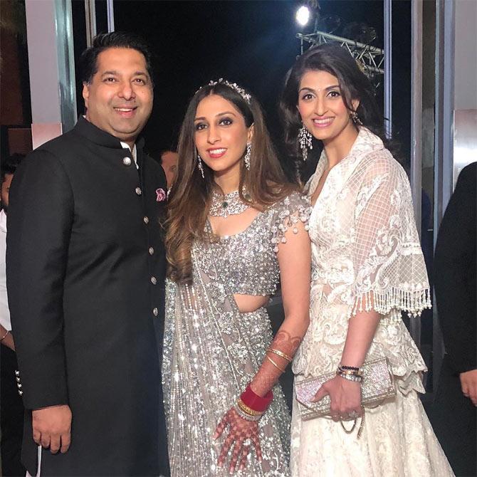 After the wedding ceremony, the duo hosted a reception for their industry friends. From SRK, Gauri Khan and Karan Johar's impeccable dance performance to Tara Sutaria and Aadar Jain's loved-up dance, the bride and the groom witnessed it all!
In picture: Anissa Malhotra with sister Akanksha Malhotra and brother-in-law Rohit Aggarwal.