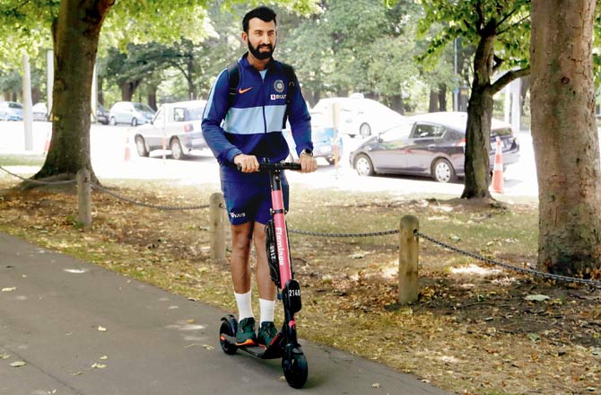 Cheteshwar Pujara rides an electric scooter as he leaves the training session on the eve of the second Test v New Zealand yesterday. Pic/PTI 