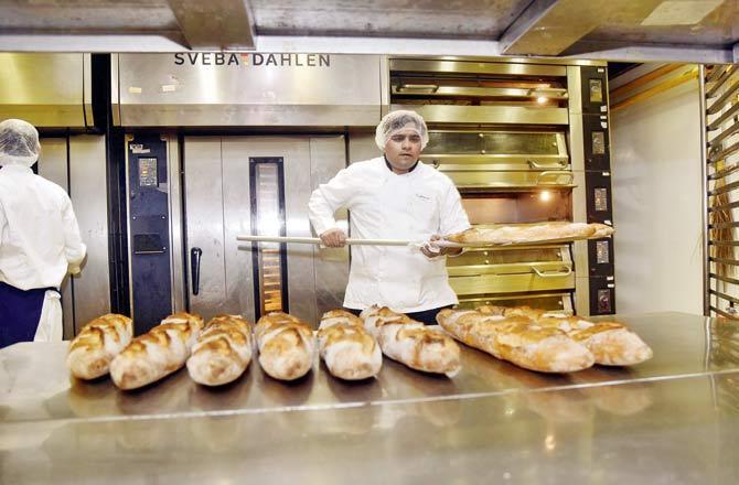 Chef Pranay Singh Thakur making baguettes at the central kitchen in Deonar. The patisserie, which started in 2004 with three helpers, now has a staff of 300, and branches across the country. Pic/Pradeep Dhivar