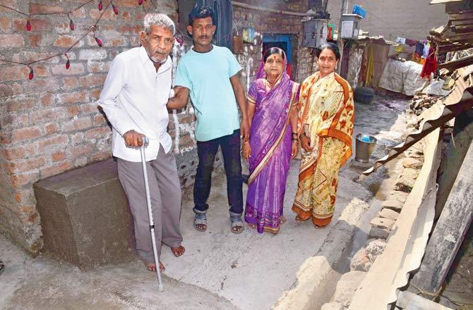 Hindurao Ingale with his wife and family at his home in Satara. File pics