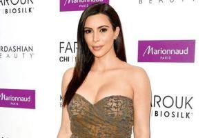 Kim Kardashian caught kissing hubby Kanye in public