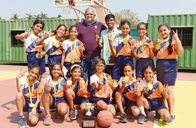 The Rajhans Vidyalaya (Andheri) girls are all smiles as they pose with the U-11 winner