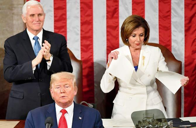 US House of Representatives Nancy Pelosi rips a copy of Trump