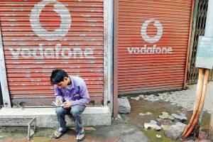 Tata pays Rs 2,190 crores, Vodafone Rs 2,500 crores to DoT as dues