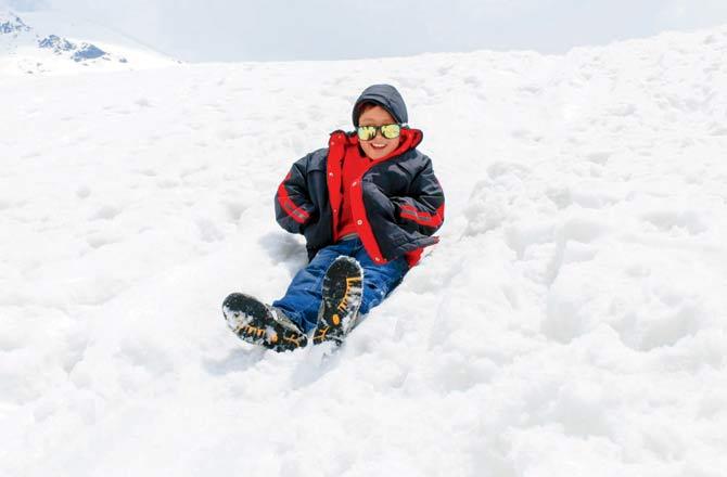 A child sliding at Zero point, in North Sikkim in Yumthang 