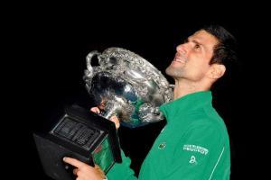 Dizzy, dehydrated Djokovic wins record eighth Australian Open title