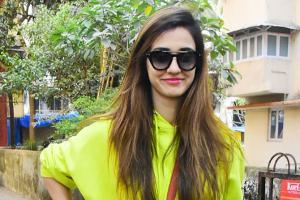 Disha's neon sweatshirt is proof winter and fashion go hand in hand!