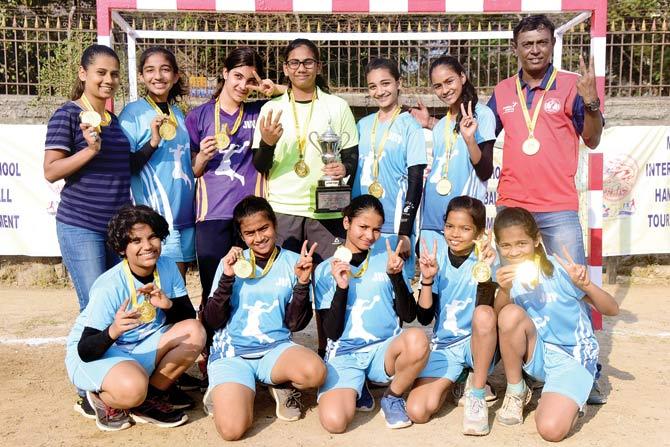 JB Vachha (Dadar) girls celebrate with the U-14 handball trophy  after their win over Vibgyor ICSE (Goregaon) in the final on Monday