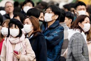 Extremely worried about Coronavirus, says Tokyo Olympics boss People wear masks amidst growing fear of the Coronavirus infection in Tokyo, Japan, recently. Pic/AFP
