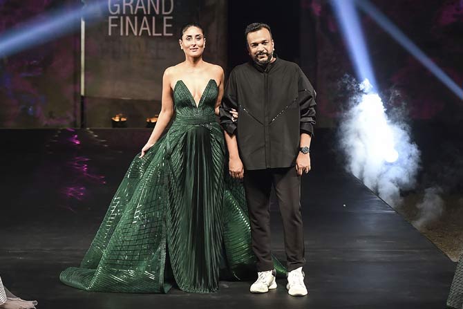 Kareena Kapoor, left,along with designers Amit Aggarwal ,right walks the ramp to show case the creation during the Lakme Fashion Week in Mumbai