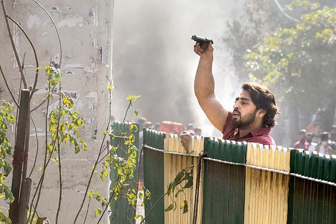 A man was seen brandishing a pistol during the clashes at Jaffrabad