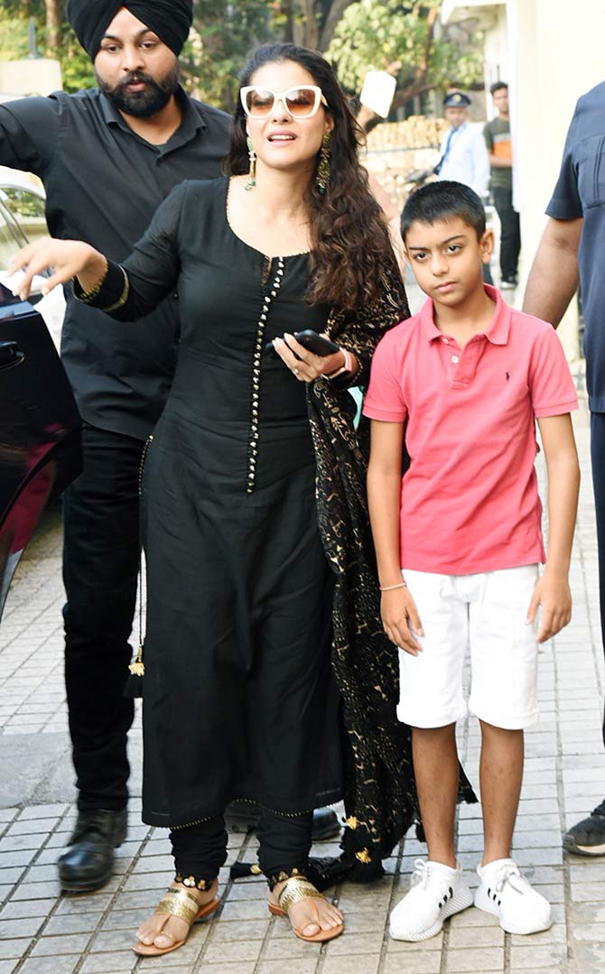 Kajol along with son Yug Devgan arrives for the special screening of Tanhaji: The Unsung Warrior at the preview theatre in Juhu. Kajol plays Savitribai, Tanhaji's wife in the film.