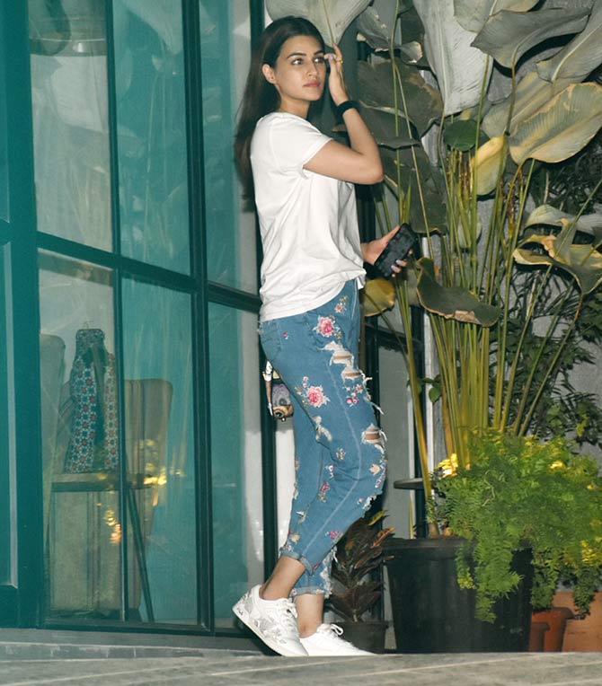 Kriti Sanon was also spotted at Dinesh Vijan's office in Santacruz. Kriti kept it casual in a white tee and distressed denim and sneakers.