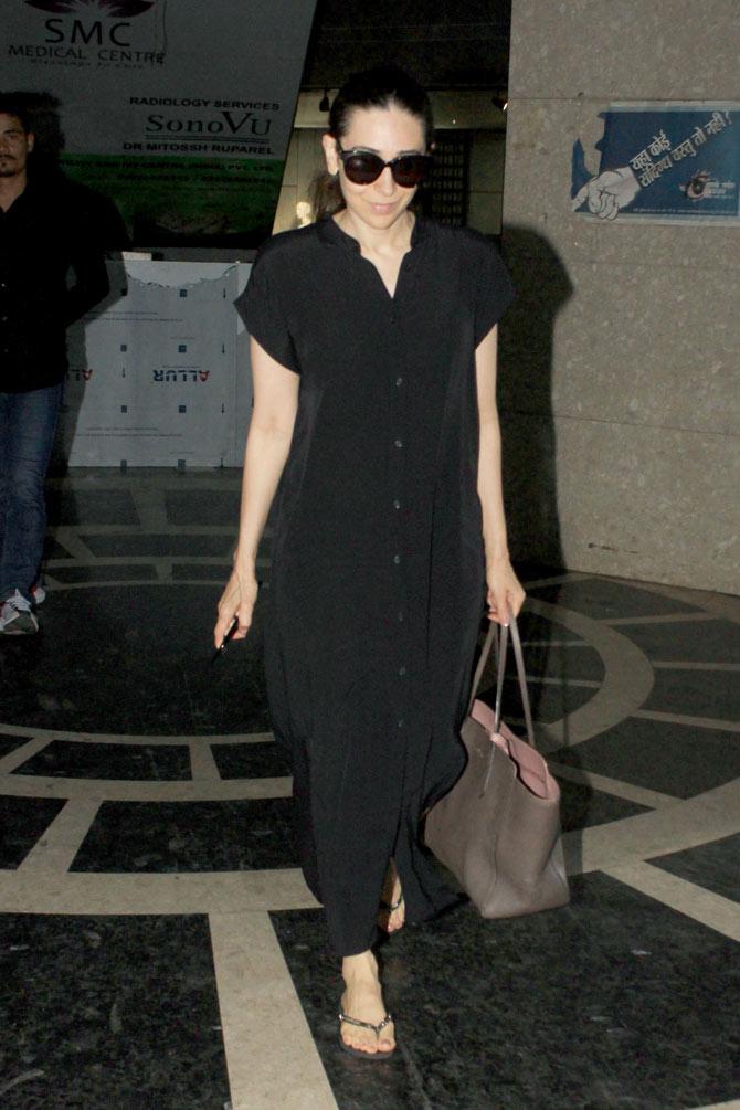 Karisma Kapoor was clicked strolling the streets of Bandra. Her all-black attire perfected her charming look.