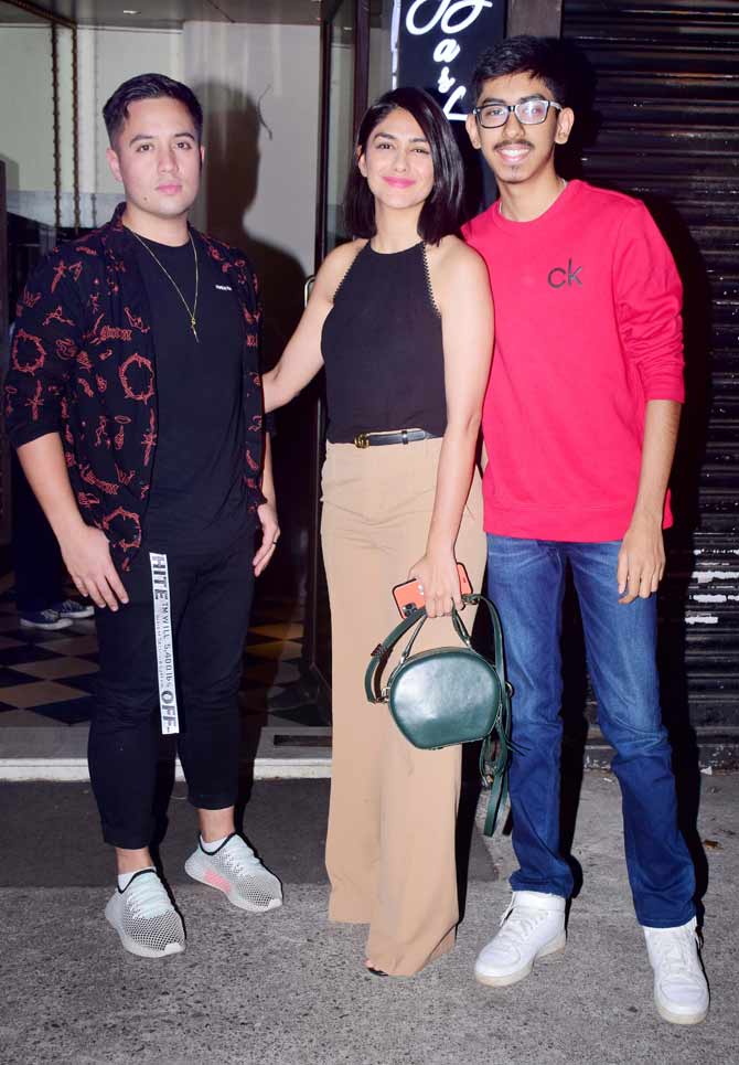 Mrunal Thakur was clicked enjoying dinner with her a friend and her younger brother Mandar Thakur. The Super 30 actor's upcoming films include Umesh Shukla's situational comedy, Namune, Hindi remake of Telugu blockbuster Jersey, starring Shahid Kapoor, Rakeysh Omprakash Mehra's boxing drama, Toofan, with Farhan Akhtar, and two Netflix productions.