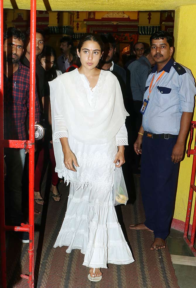 During her visit to the famous temple, Sara Ali Khan aced the all-white look in a white sharara suit and kept her hair-do simple with a pleat. Pretty, isn't it?