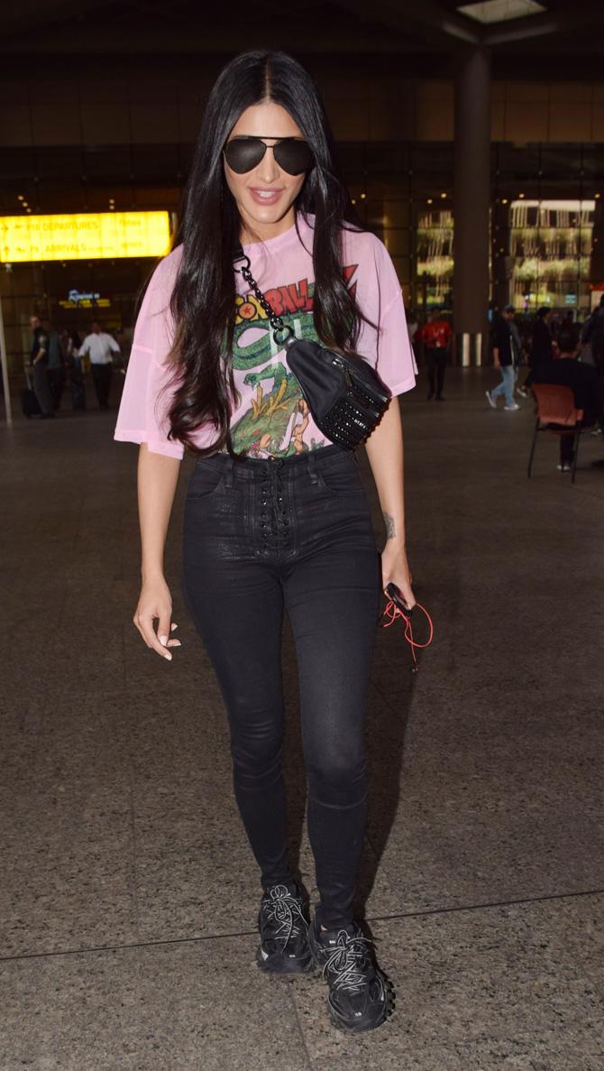 Shruti Haasan was also clicked at the airport, the actress sported a casual look in a pink printed tee and black denim.