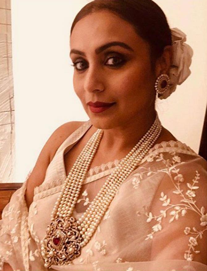 Rani Mukherji exuded royalty in a sheer floral embroidered saree by the ace designer. With a heavy pearl necklace and earrings, the diva looked resplendent. She gave it a classy look with a pristine white flower which was tied in her sleek bun.