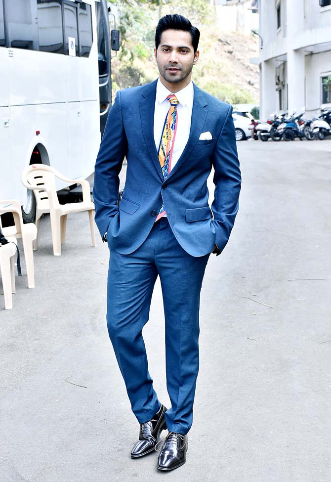 For the promotional event, Varun, who is known for his chiseled body, transformed himself into a formal avatar. The 32-year-old actor opted for a white shirt, blue suit, and pants. We don't remember, the last time we saw him all suited and booted. Can you recall it for us?