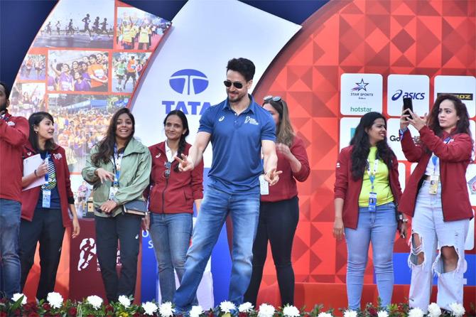 In photo: Bollywood actor and fitness icon Tiger Shroff shows off the victory sign as he poses for the lenses