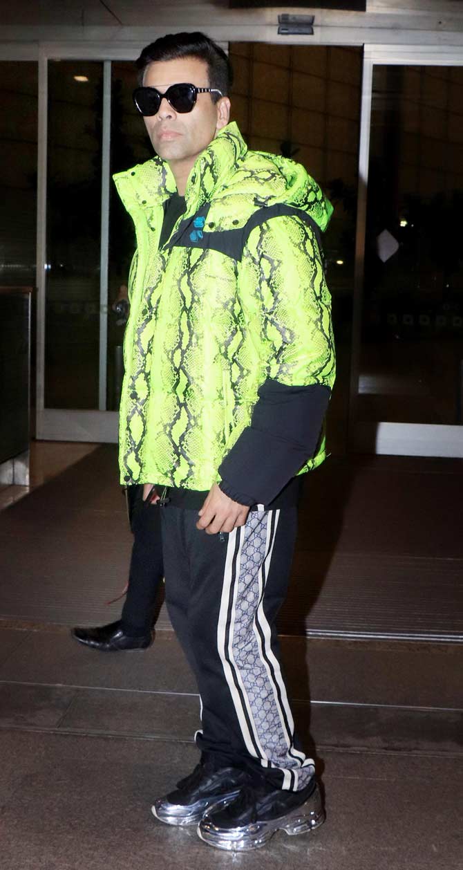 Karan Johar posed for the shutterbugs when snapped at the Mumbai airport.