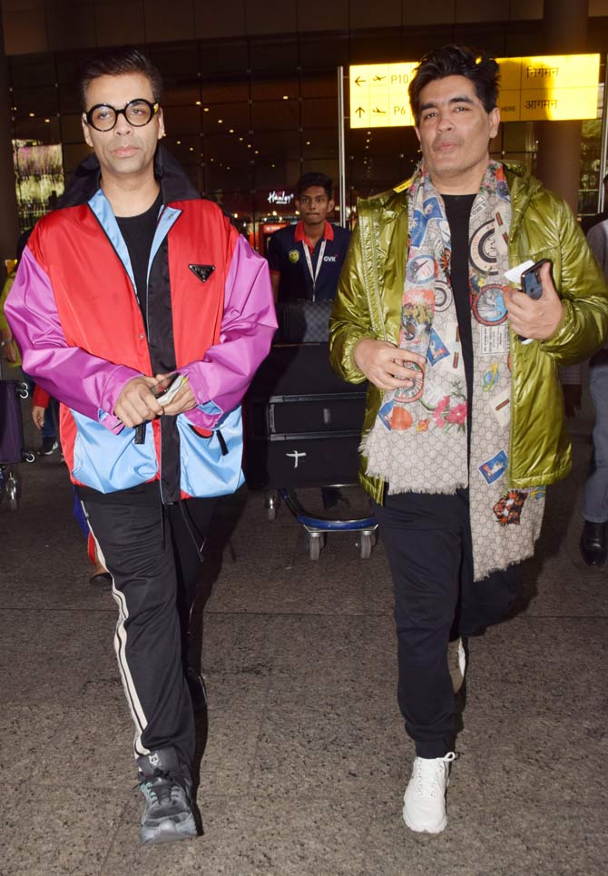 Filmmaker Karan Johar and designer Manish Malhotra return from London. The duo celebrated New Year's with Karisma Kapoor and other celebs.