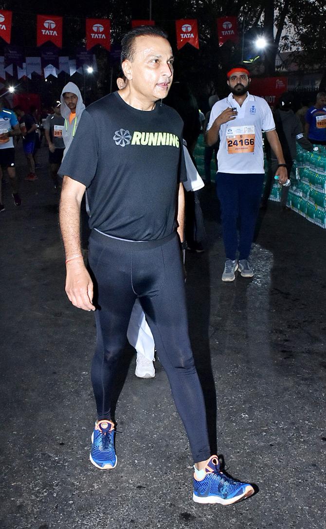 Anil Ambani was snapped running the race with other marathon runners. His t-shirt sported a caption that read 'Running' in capital letters.