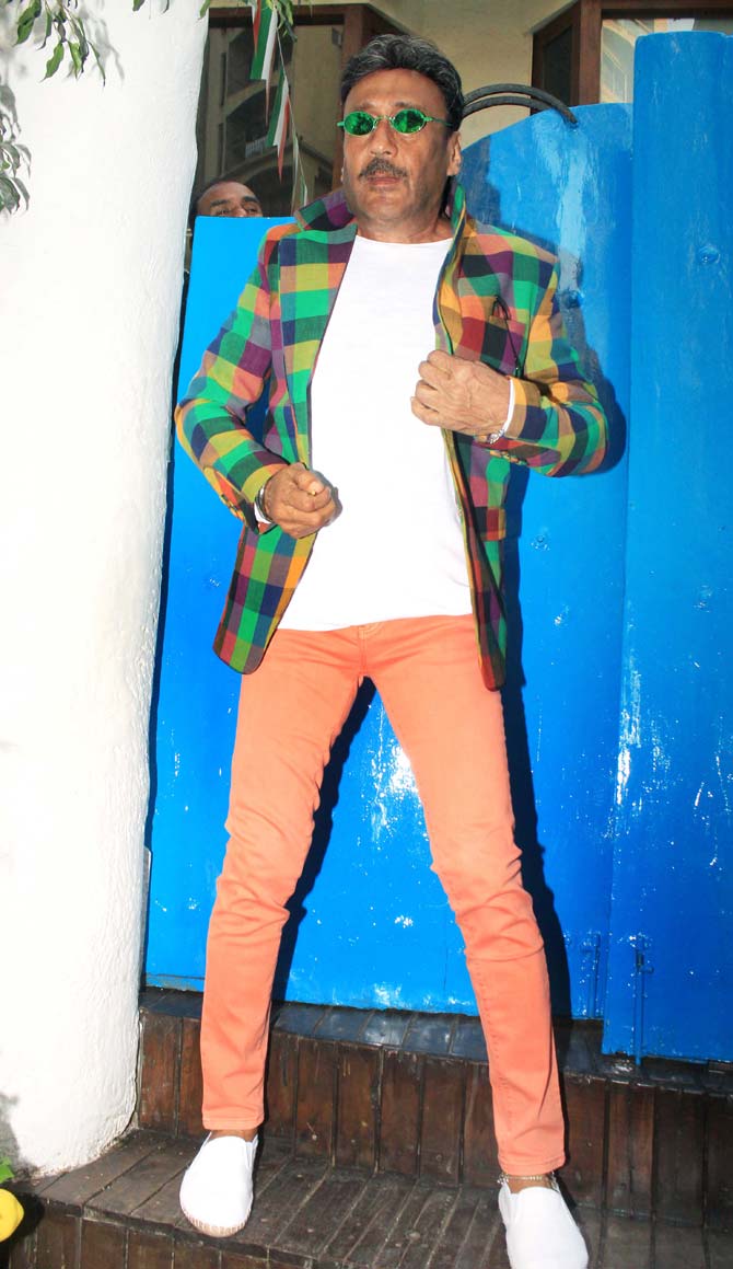 If you are impressed with Zayed Khan's formal avatar, then you will certainly like Jackie Shroff's uber cool look. The actor donned a white t-shirt, a multi-coloured jacket and peach trousers for the outing. And, we loved his green funky glares.