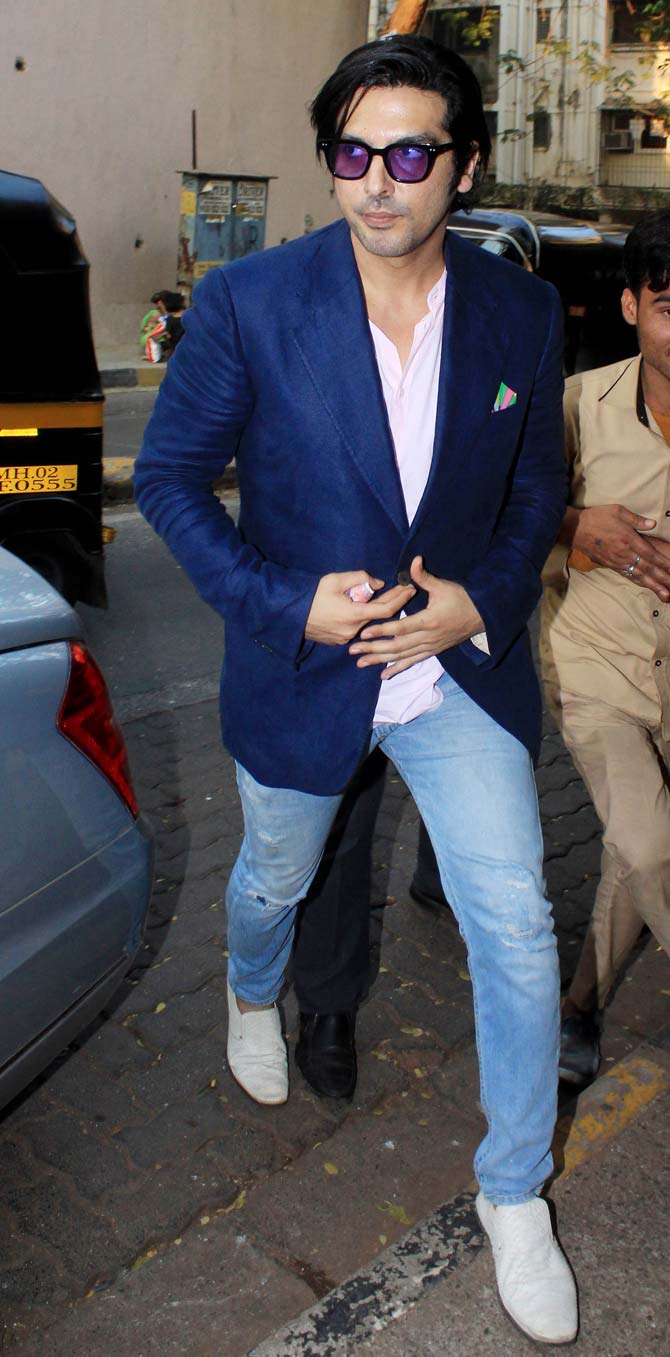 Zayed Khan unleashed his formal avatar for the Kim Sharma's birthday bash opting for a blue suit, pink shirt, and denim.