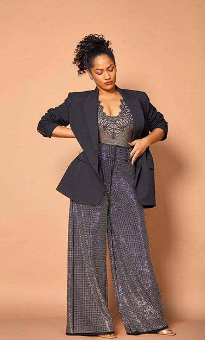 Masaba Gupta wore a grey overall and paired it with a black coat. 