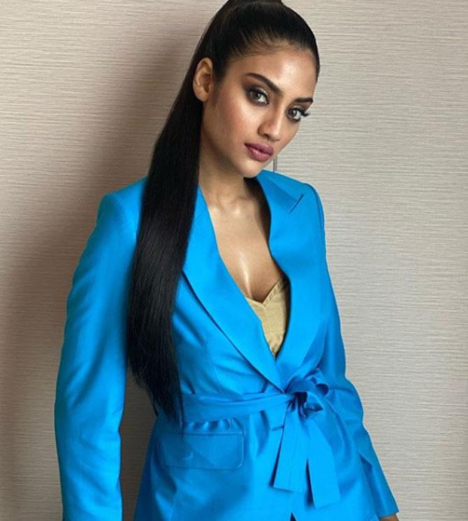 Actress-turned-politician Nusrat Jahan donned a blue coat with a golden inner. She wrote, 