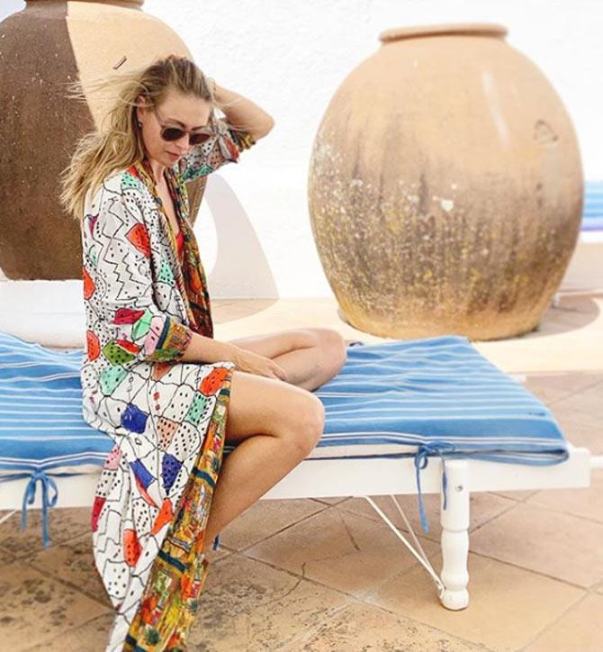 Sporting a bikini and a beach robe, Sharapova captioned this picture, 'When your instagram grid is still on vacation In the perfectly made, reversible beach robe.