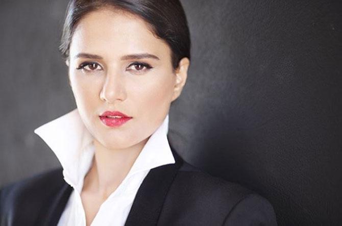 Shipra Khanna added a hue of colours as she wore red lipstick with a black and white suit. She pulled her hair back in a bun and looked ravishing.