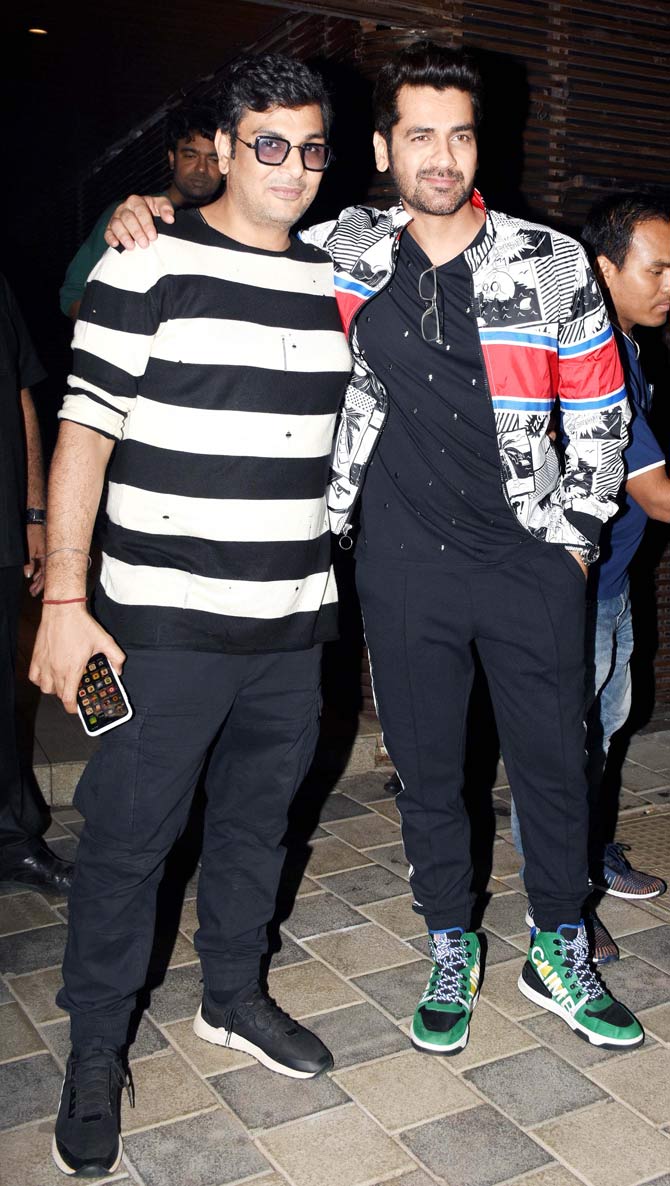 Mukesh Chhabra and Arjan Bajwa posed for the paparazzi as they arrived at Sudhir Mishra's birthday celebration.
