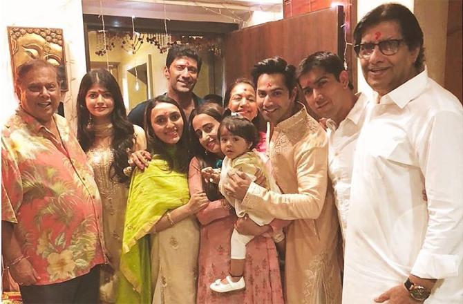 A Diwali family click featuring Varun Dhawan with dad David, girlfriend Natasha, mother Karuna Dhawan, brother Rohit Dhawan with wife Jaanvi Desai and their cute little daughter Niyara, and uncle Anil Dhawan.