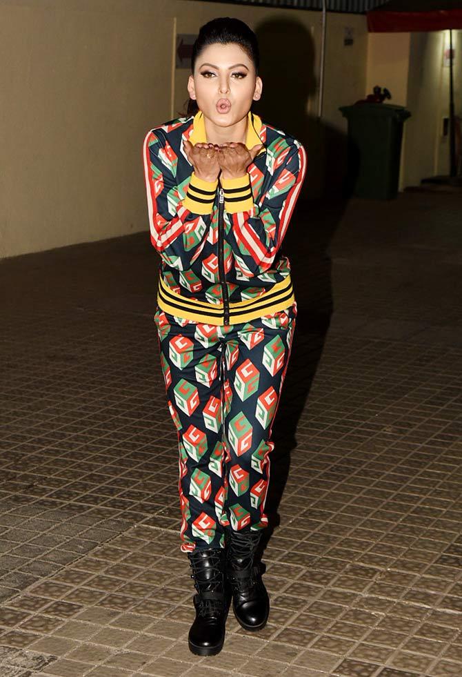 Urvashi Rautela blows kisses at the photographers as she arrives for the special screening of Street Dancer 3D at a popular multiplex in Juhu.