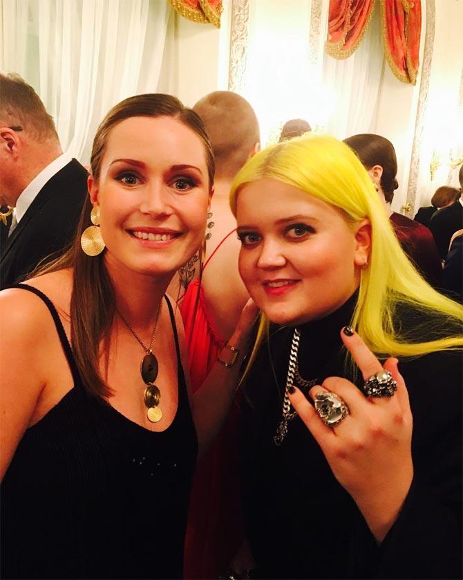 Sanna Marin along with Finnish singer and songwriter, Alma.  
