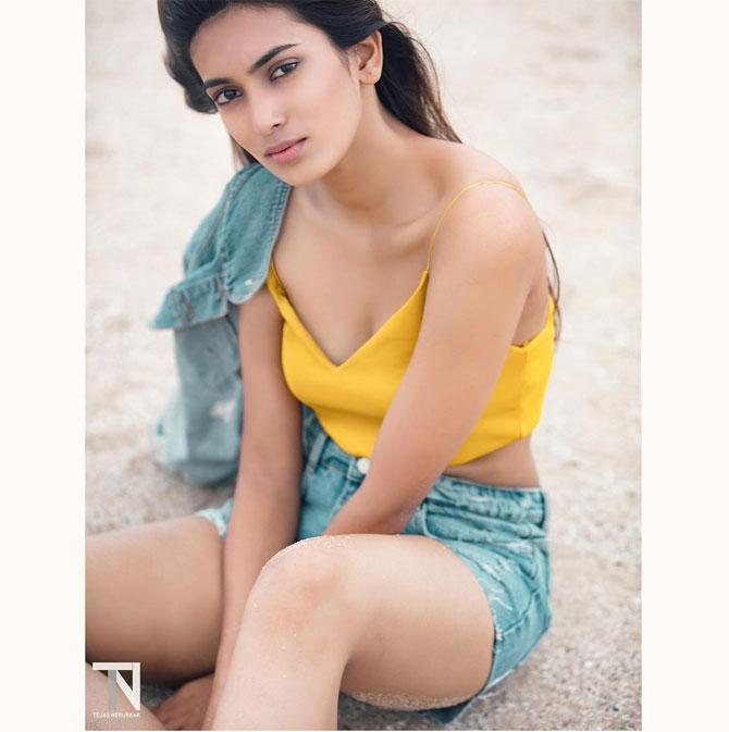 Andhale shines like the sun in a yellow tank with a pair of denim pants and denim jacket.