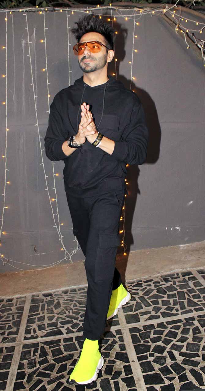 Aparshakti Khurana was casual in an all-black outfit paired with neon yellow sneakers and oversized glares at the wrap-up bash of Helmet.