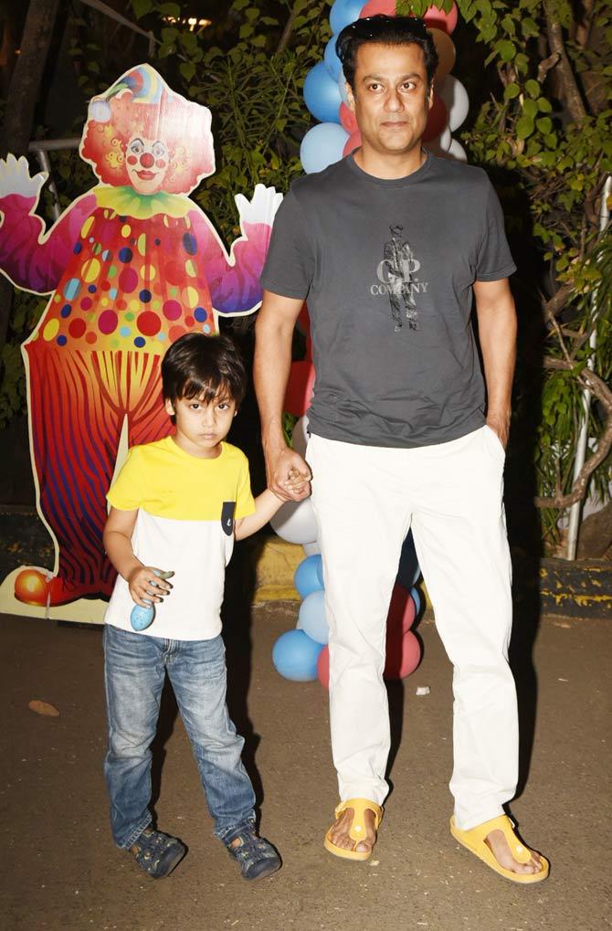Kedarnath director Abhishek Kapoor with son Isaana at the bash.