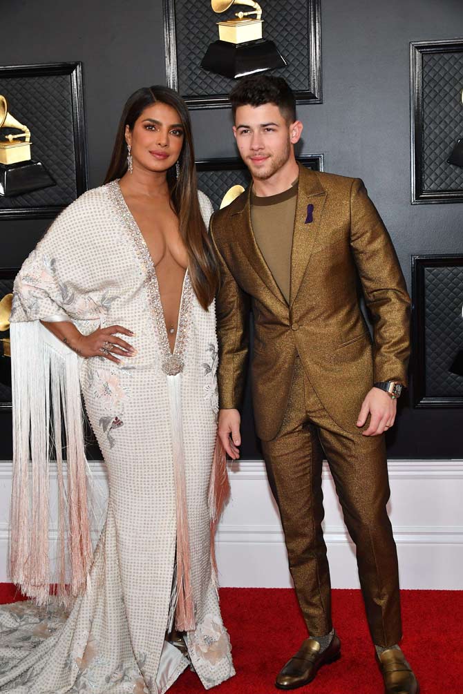 While Priyanka Chopra Jonas stole the limelight with her much-discussed ensemble, Nick Jonas looked dashing in a head-to-toe gold suit that included gold-toned loafers. This is the power couple's second award season appearance as in January they were presenters at the Golden Globes.
