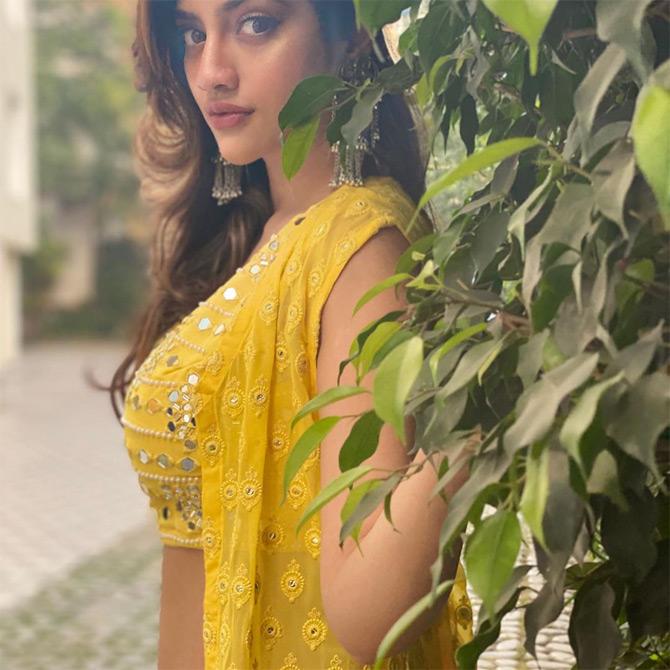 In photo: Nusrat Jahan looks fresh like a sunflower while being caught in a candid moment.