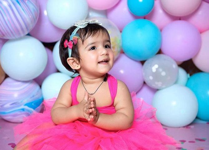 The new mommy has never shied from sharing her daughter's pictures. She posted this picture of Miraya in a bright pink dress as she smiled while there were a lot of balloons in the background.