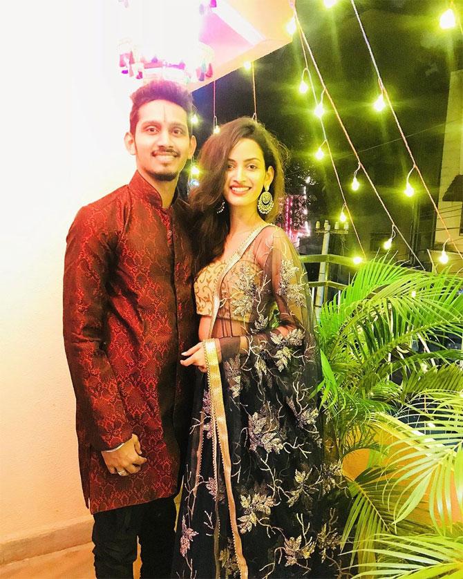 She serves inspiration for a festive look in this black lehenga with a golden, embellished blouse.