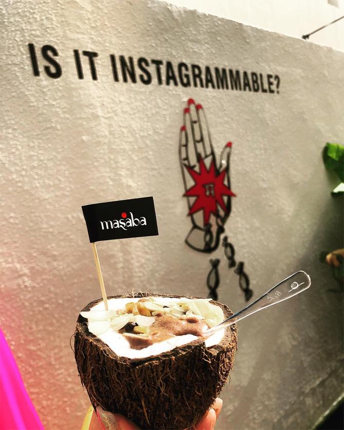 In photo: Masaba Gupta relishes a vegan coconut bowl during the launch of her resort wear in Dubai.






