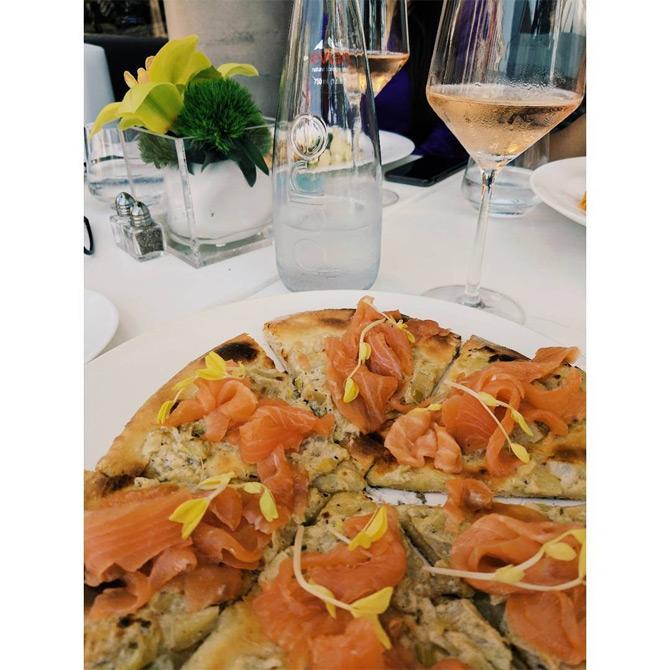 In photo: Masaba Gupta can be seen enjoying a delicious pizza to which she captioned: Truffle plus rose!

